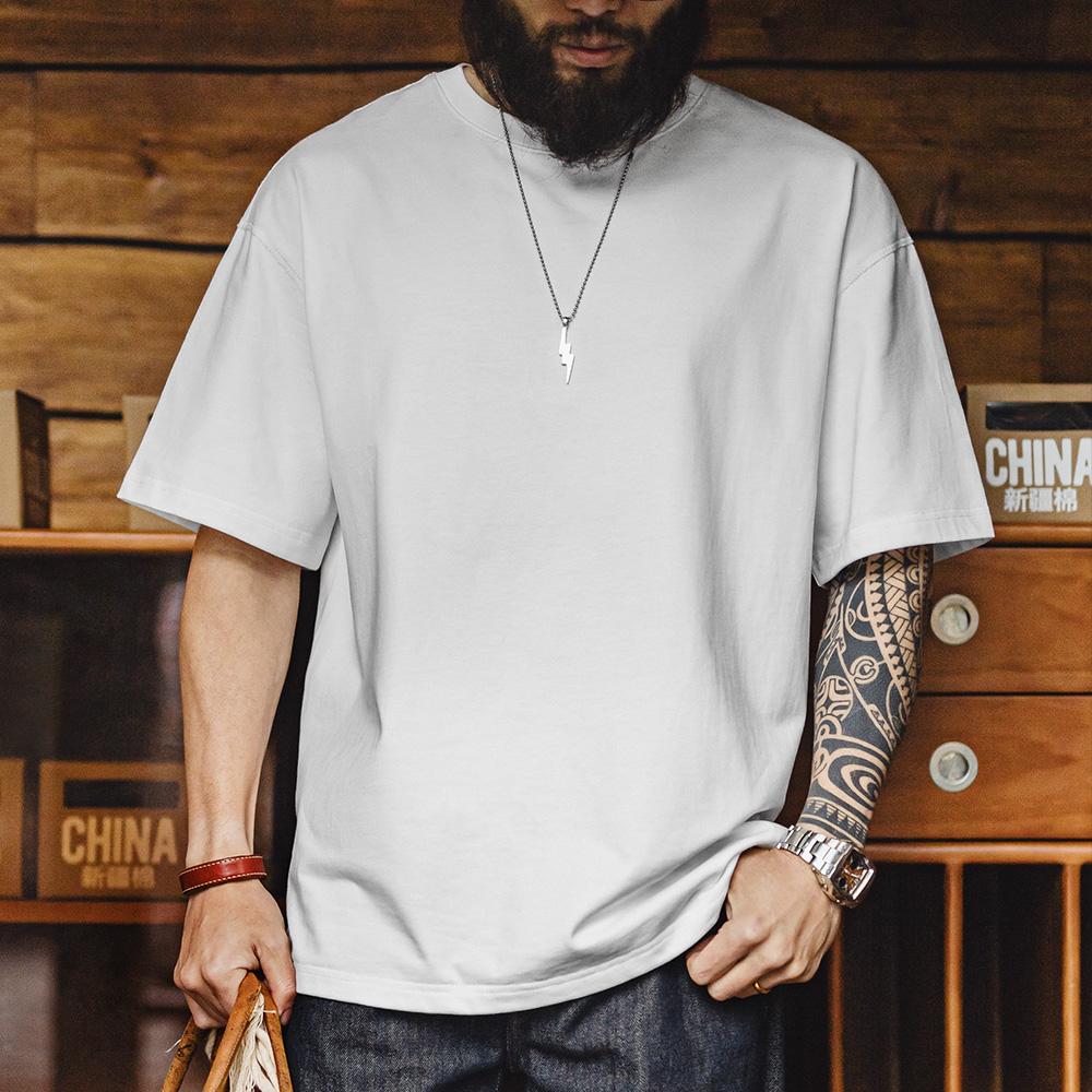 Camiseta de algodón pesado de ajuste relajado y cuello redondo MADEN