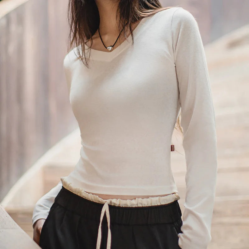 T-shirt à manches longues en maille de coton, col V, coupe ajustée, pour femme, idéal pour l'automne et l'hiver. Pull basique à porter sous un pull. 
