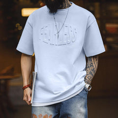 Camiseta de algodón pesado con estampado de letras en relieve 3D MADEN
